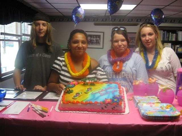 ECHO 8th grade graduation celebration — teens with cake and leis