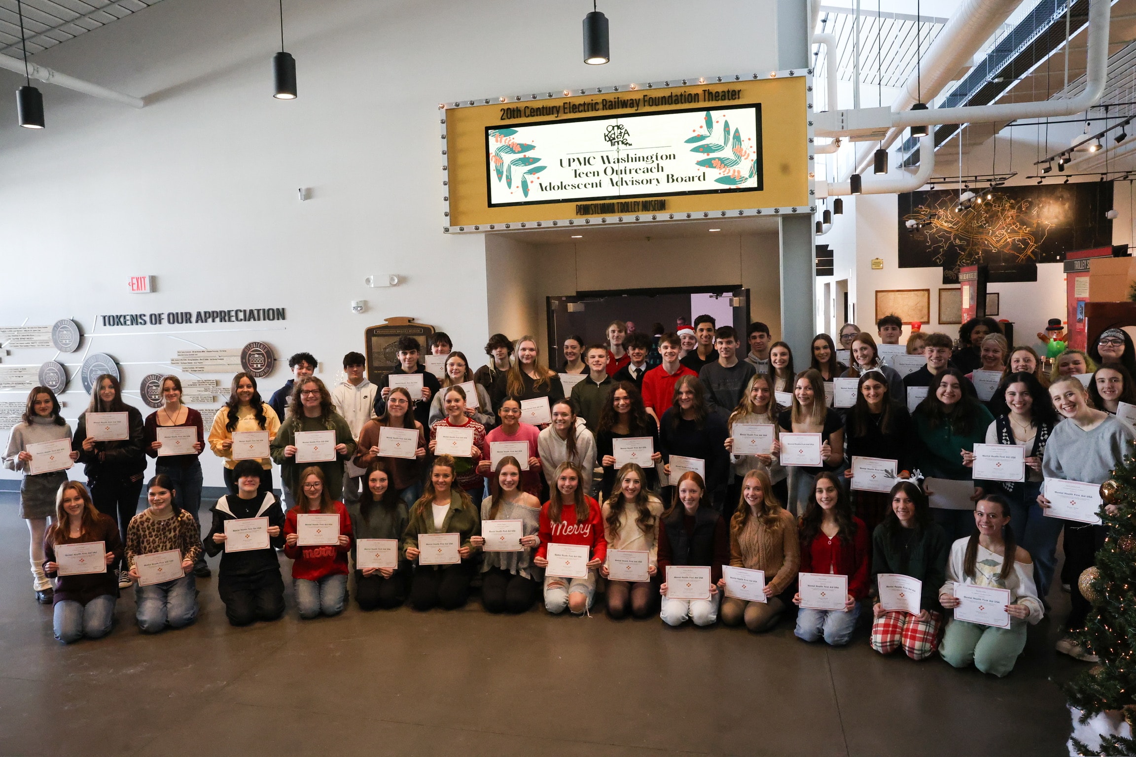 Road to Better Mental Health Education — teens with certificates